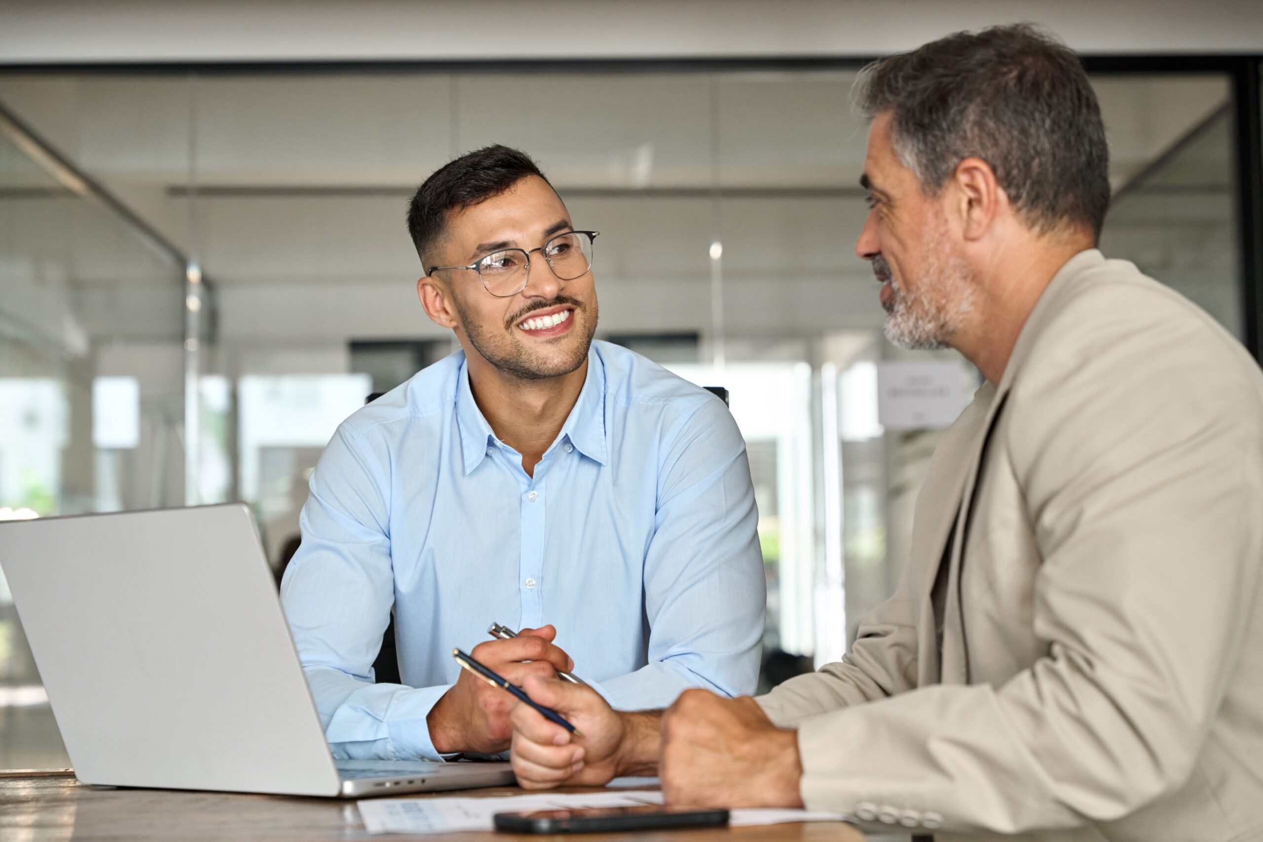 Young sales professional listening intently to a client