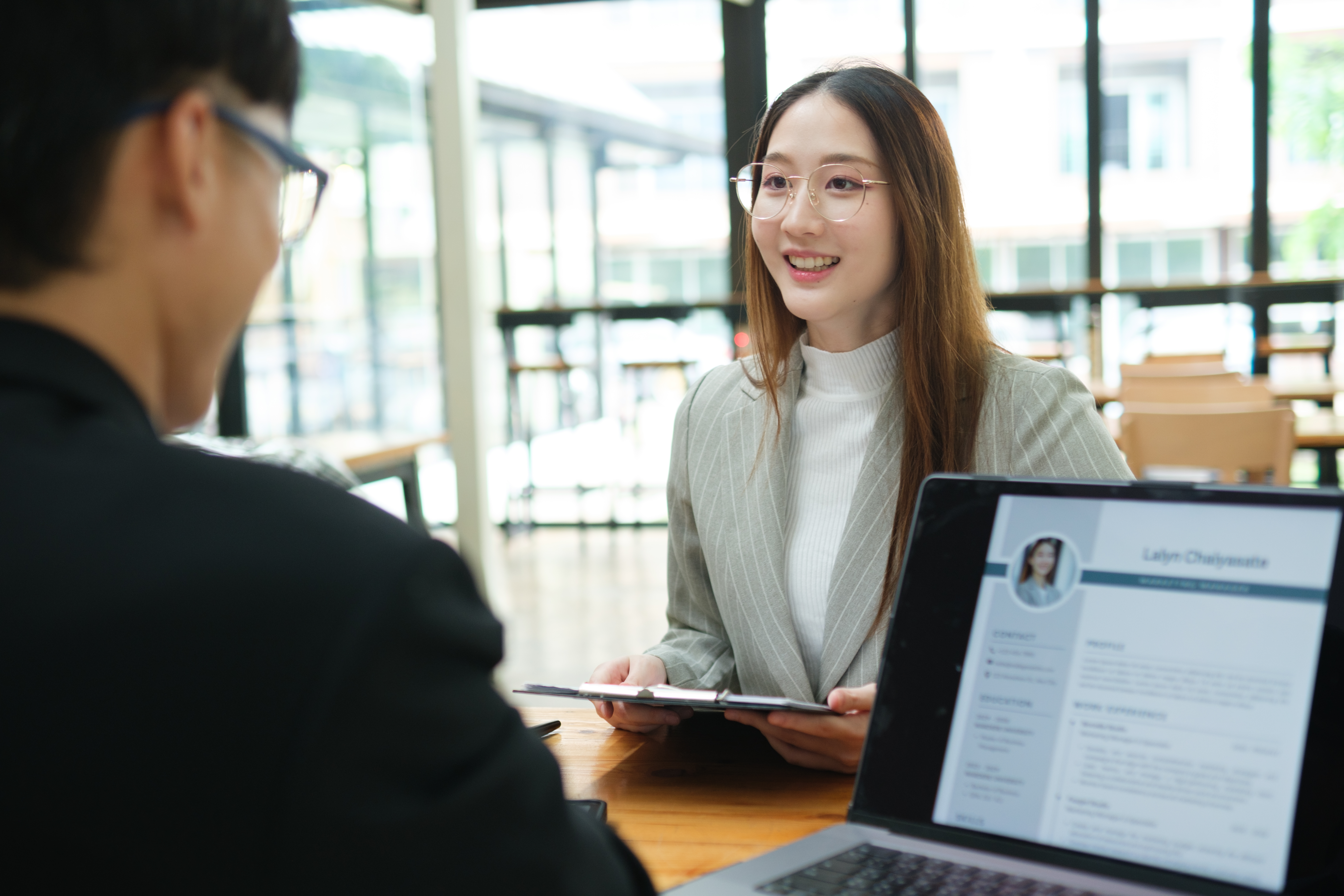 A job applicant discussing confidently with the hiring manager.